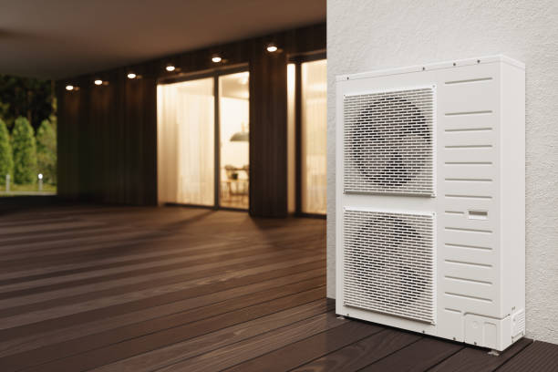 Close-up View Of Air Conditioning Outdoor Units On Building Facade At Night