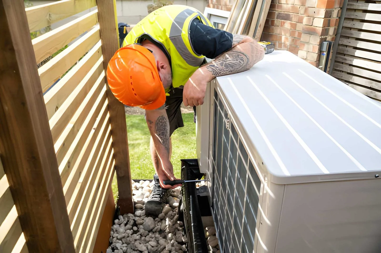 MCS-certified engineer completing an air source heat pump installation at a Scottish home