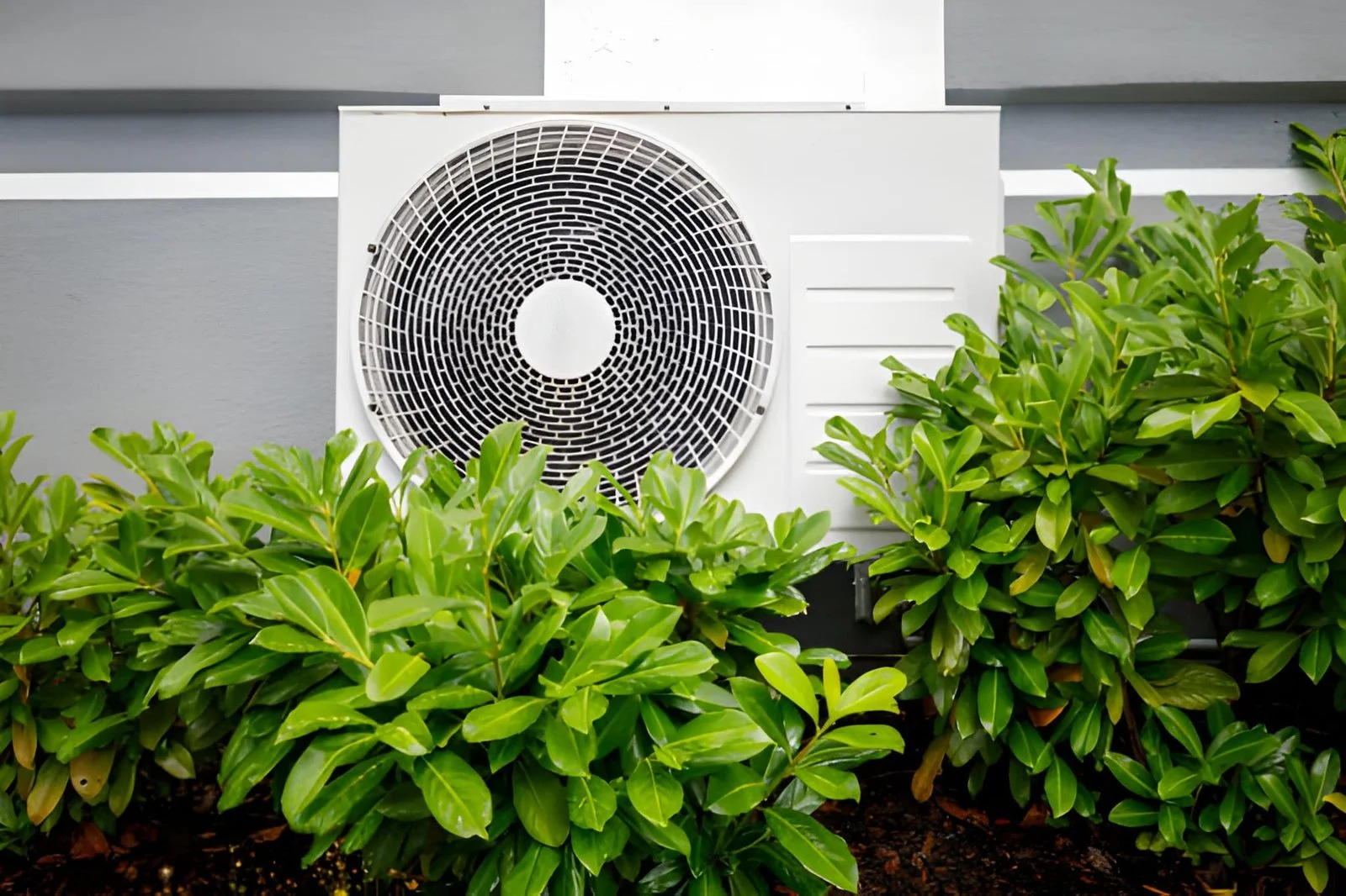 Air source heat pump unit installed outside a home in Scotland by H&R Energy Solutions